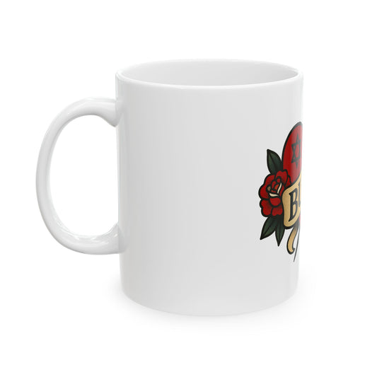 White mug with a tattoo-style design featuring a rose and letter 'Bubbe' on a white background
