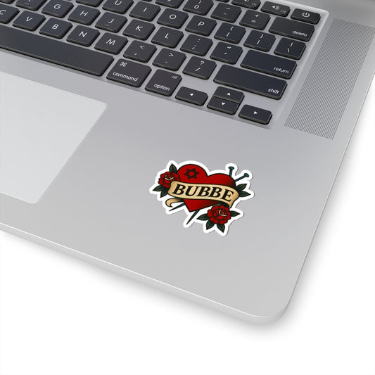 Laptop with a sticker featuring a heart design and the word 'BUBBE'.