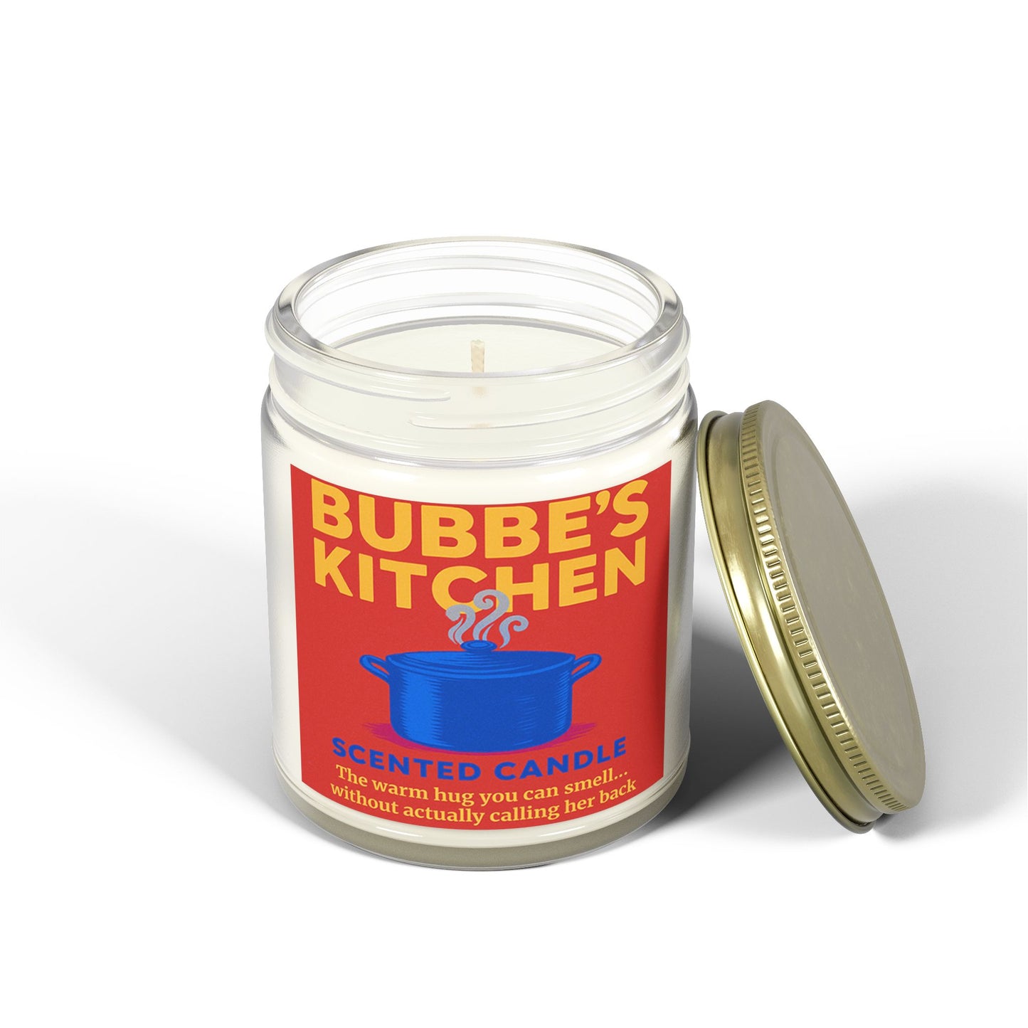Scented candle labeled 'Bubbe's Kitchen' with a red label and gold lid on a white background
