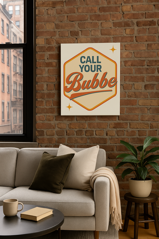 Sofa in a living room with a 'Call Your Bubbe' print on the wall.