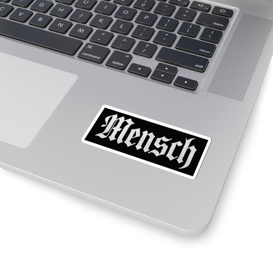 Laptop with a 'Mensch' sticker on the palm rest area