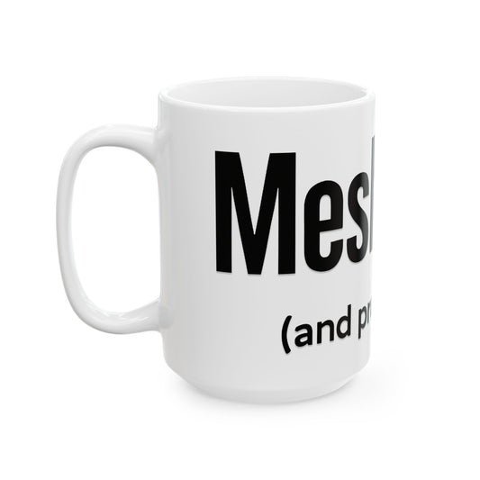 White mug with black 'meshugga' text on a white background