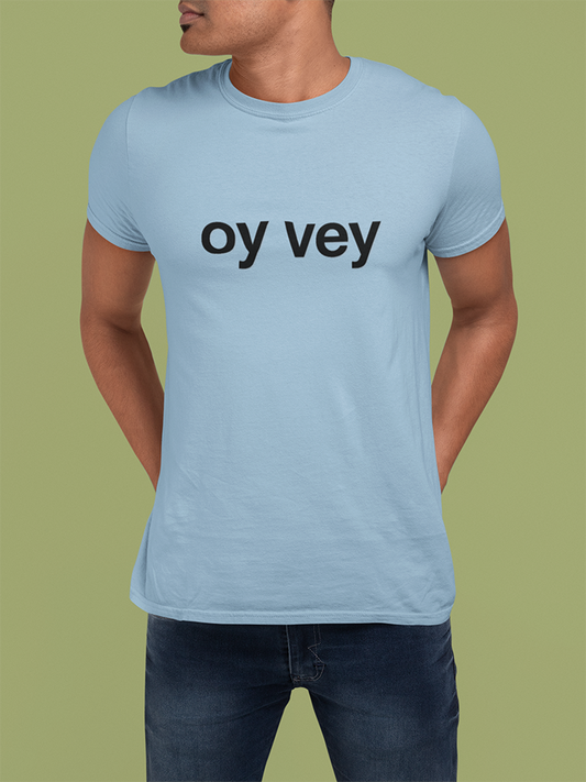 Person wearing a light blue t-shirt with 'oy vey' text on a green background