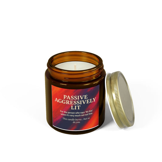 Candle in an amber jar with a colorful label on a white background