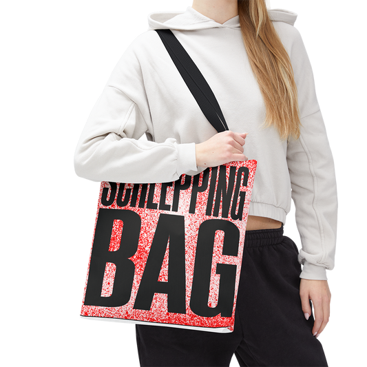 Person holding a tote bag with 'Schlepping Bag' text on a white background