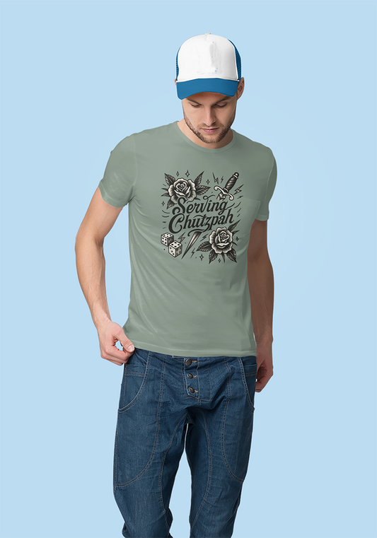 Man wearing a green t-shirt with floral design and text, blue jeans, and a white cap on a light blue background