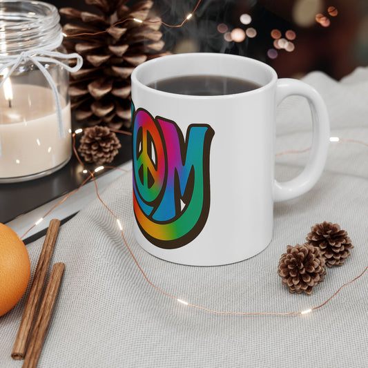White mug with colorful 'shalom' design on a table with decorative items
