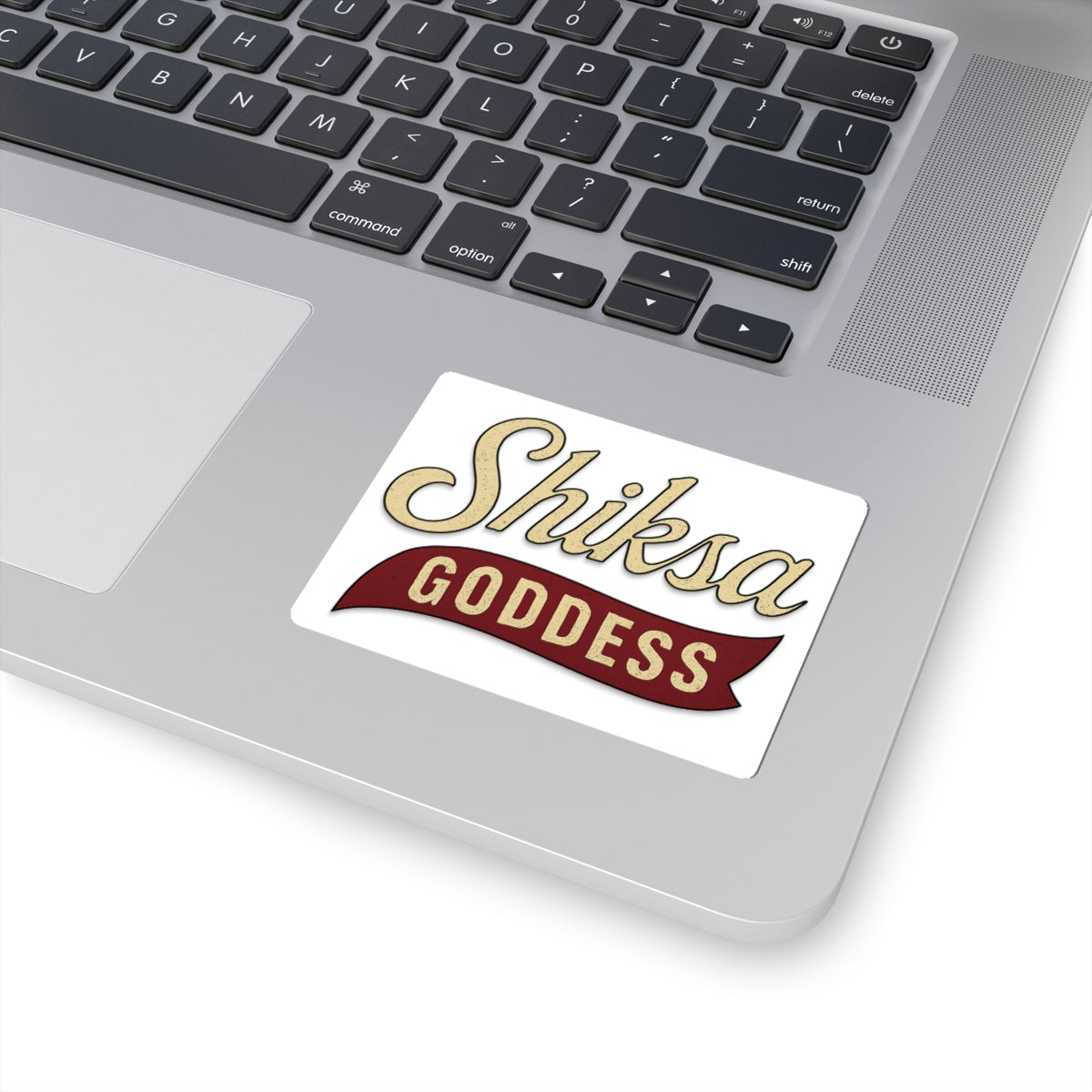 Sticker with 'Shiksa Goddess' text on a laptop