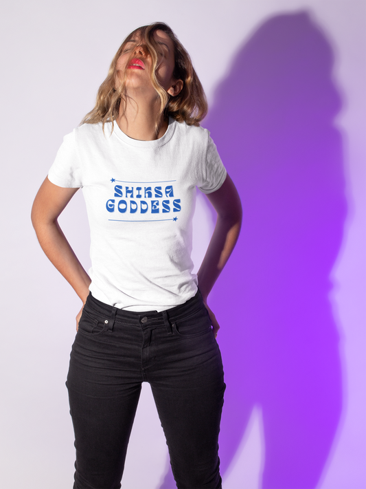 Person wearing a white t-shirt with 'Shiksa Goddess' text against a white background