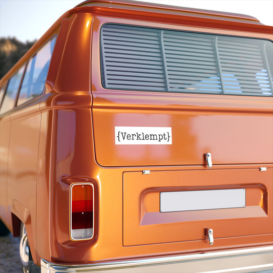 Orange van with a sticker reading 'Verklempt' on a clear day.