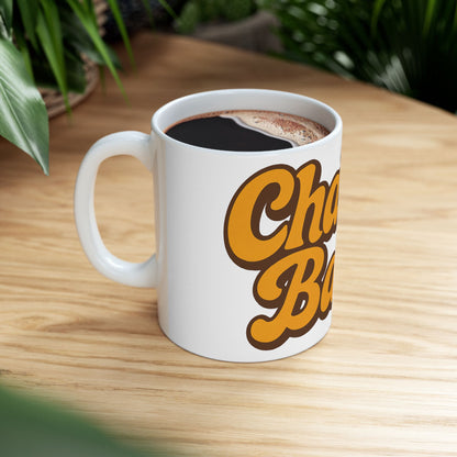 White mug with 'Challah Back' text on a wooden table