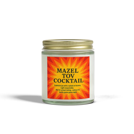 Candle jar labeled 'Mazel Tov Cocktail' with a colorful label on a white background
