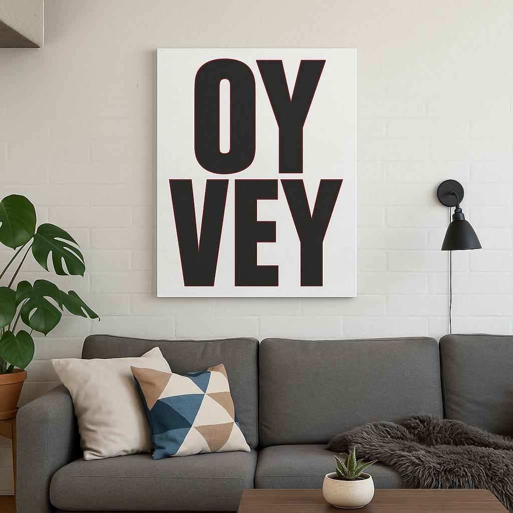 Living room with a gray sofa, decorative pillows, and a 'OY Vey' artwork on the wall.