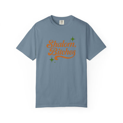 Blue t-shirt with 'Shalom, Bitches' text on a white background
