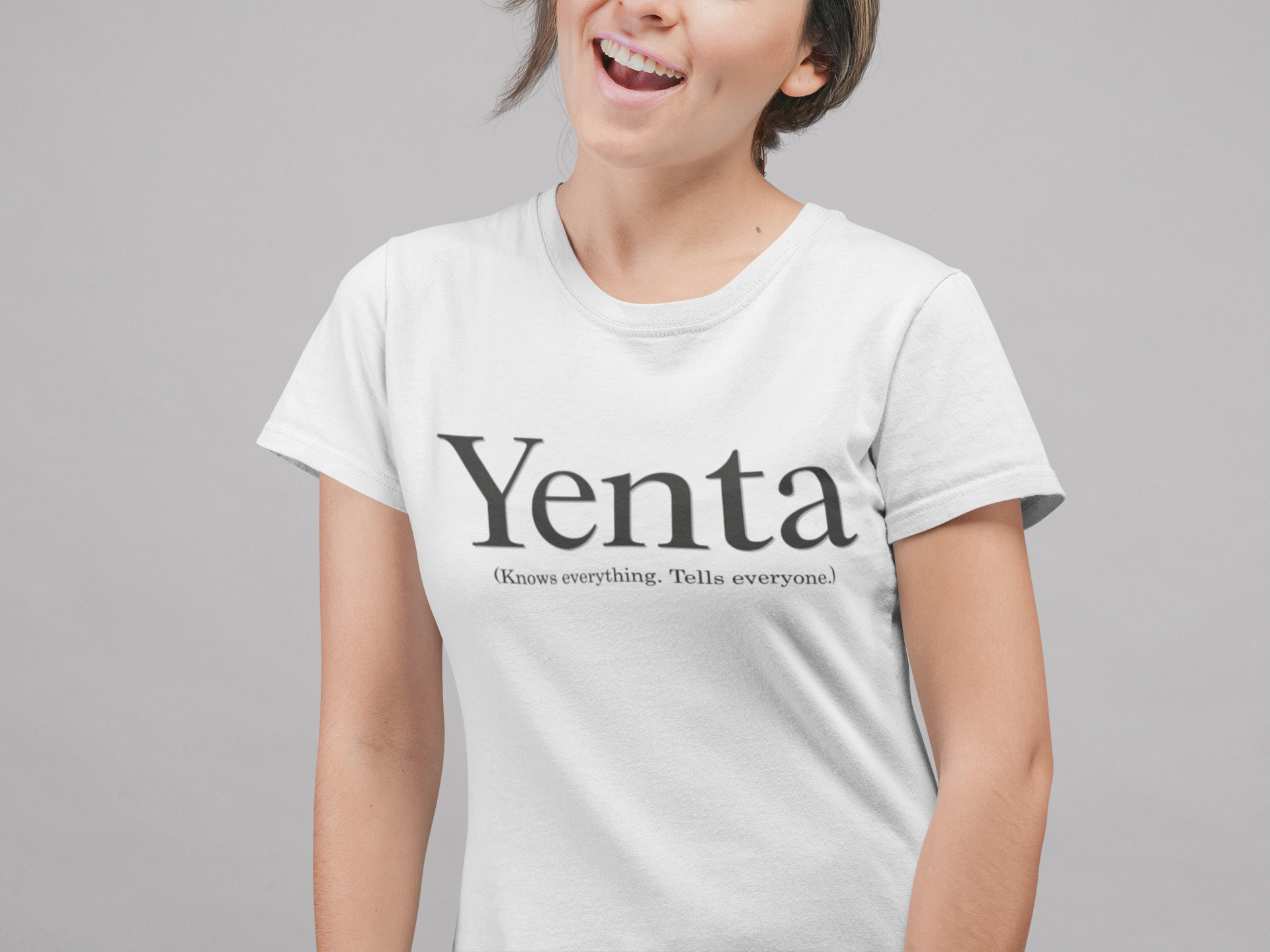 Person wearing a white t-shirt with 'Yenta does everything. Tells everyone!' text on a gray background