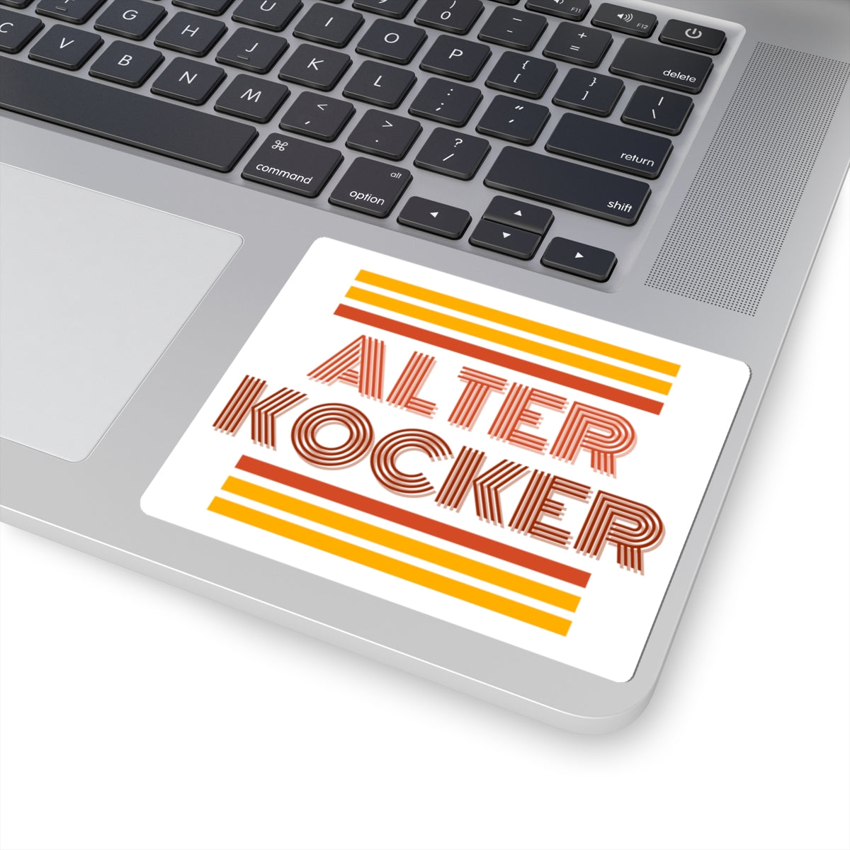 Laptop with a sticker reading 'ALTER KOCKER' on the palm rest area.