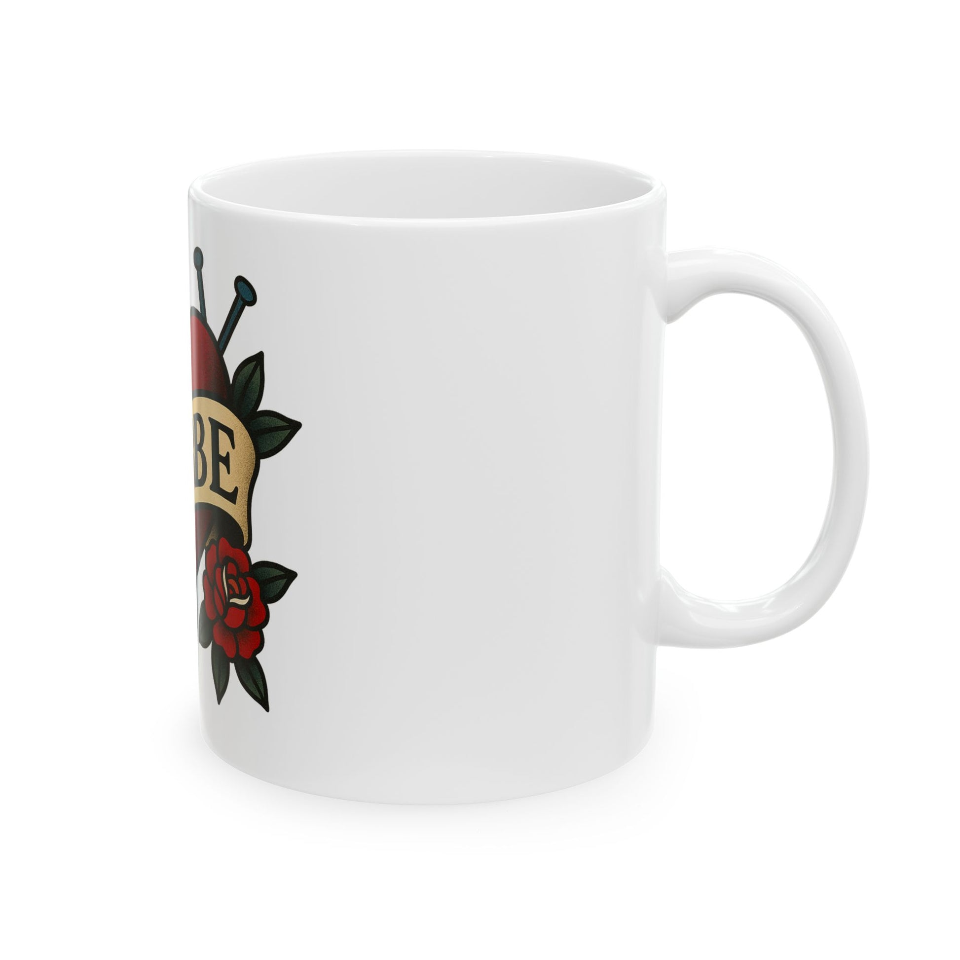 White mug with a tattoo-style design featuring roses and text on a white background