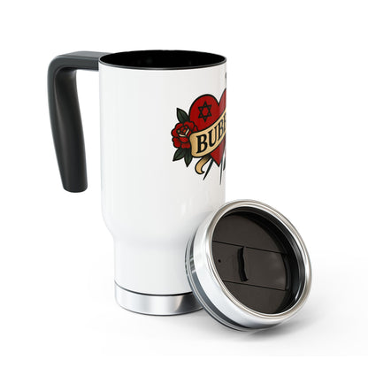 White travel mug with black interior and handle, featuring a tattoo-style design on a white background.