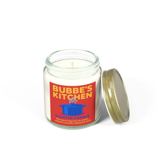 Candle in a glass jar with a red label featuring 'Bubbe's Kitchen' on a white background