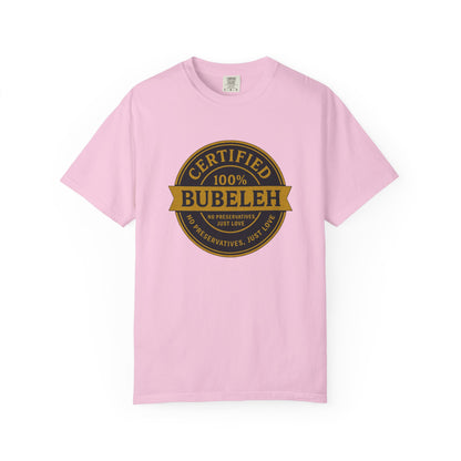 Pink t-shirt with a gold and black graphic on a white background