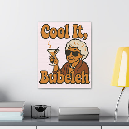 Canvas print with a cartoon character holding a cocktail and text 'Cool It, Bubeleh' on a wall.