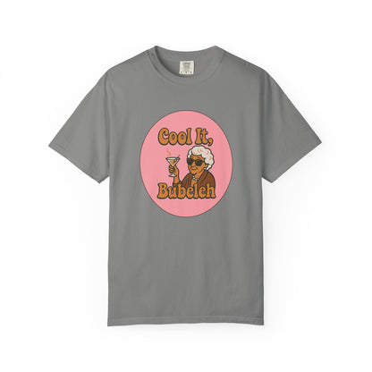 Gray t-shirt with a graphic design featuring a character holding a martini glass and text on a white background.