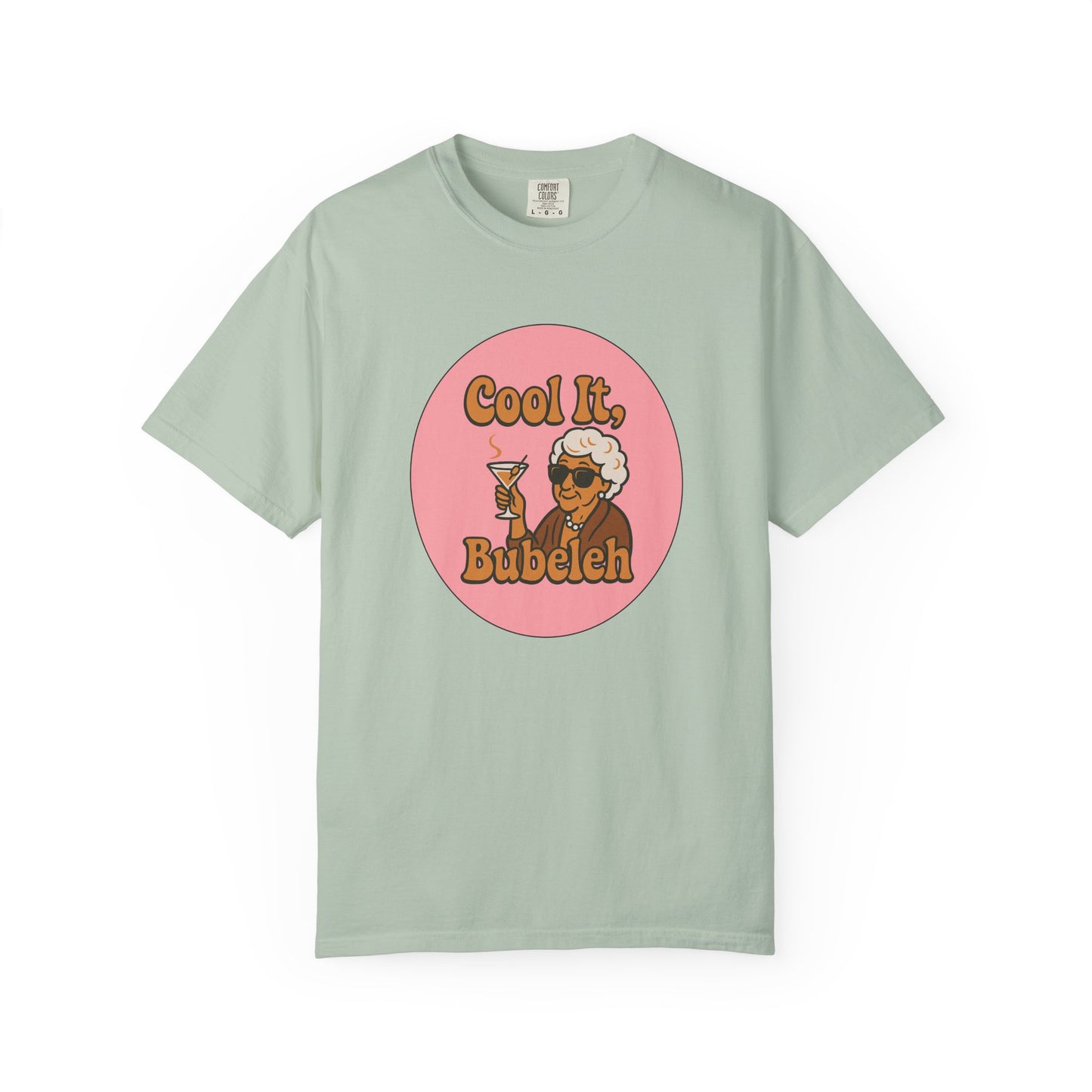 Mint green t-shirt with a graphic of a woman holding a drink and text 'Cool It, Bubeleh' on a white background