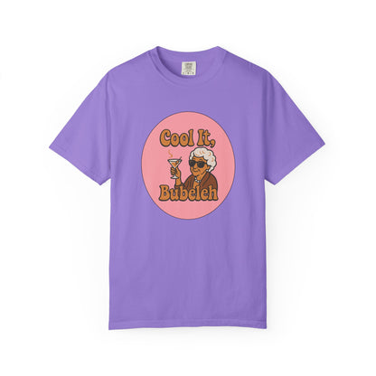 Purple t-shirt with a graphic of a woman holding a drink and text 'Cool It, Bubeleh' on a white background