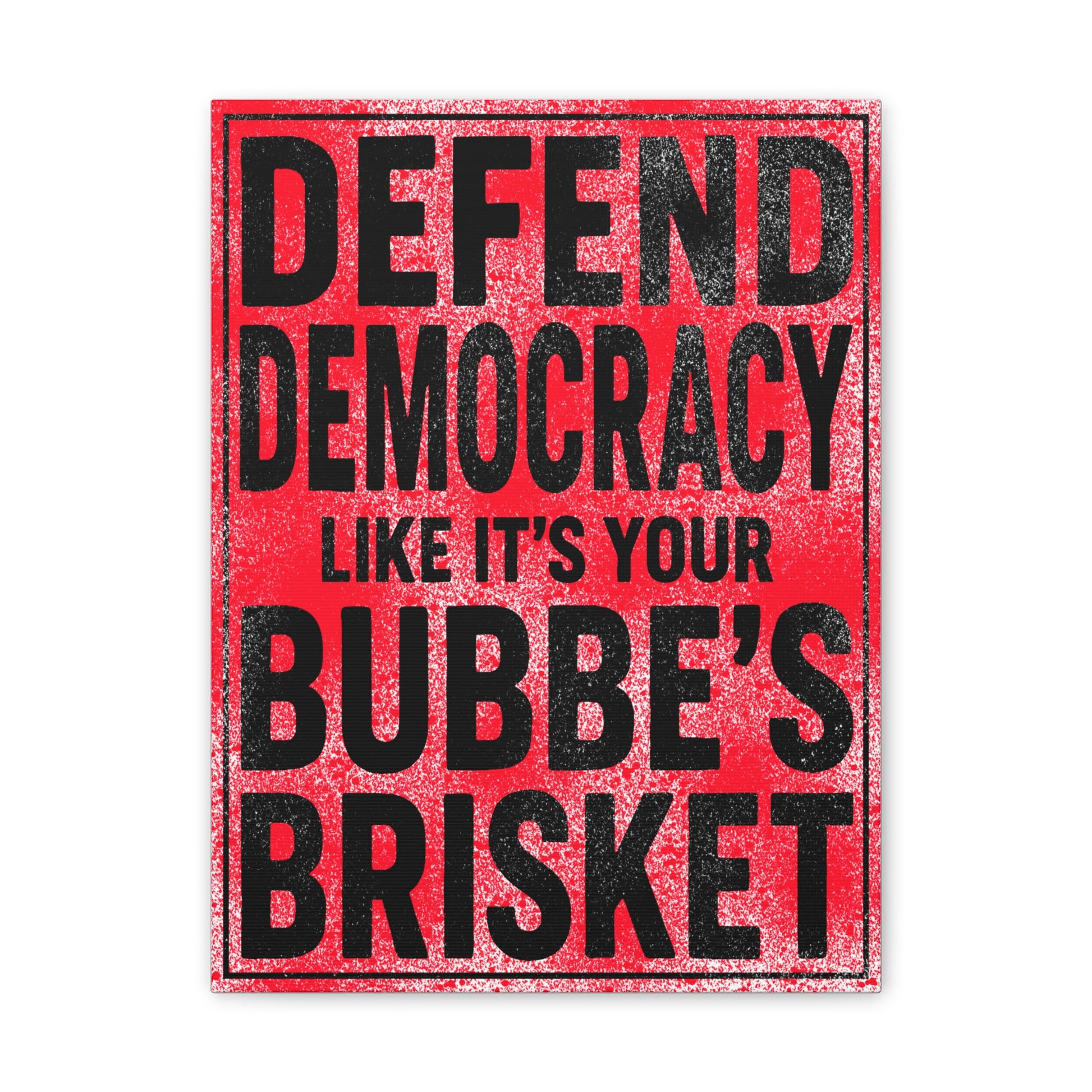 Red sign with black text reading 'Defend Democracy Like It's Your Bubbe's Brisket' on a white background