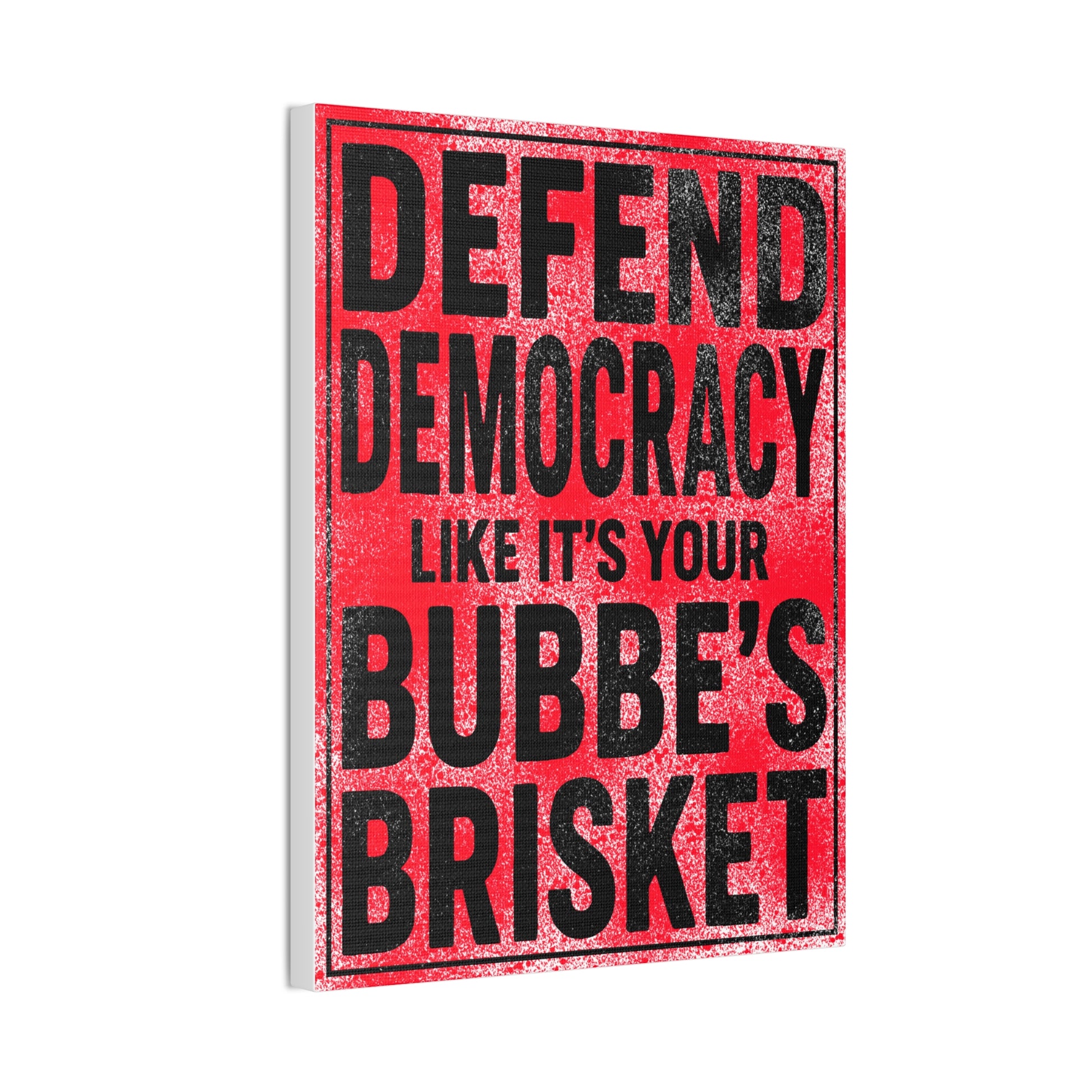 Red sign with black text reading 'Defend Democracy like it's your Bubbe's Brisket' on a white background