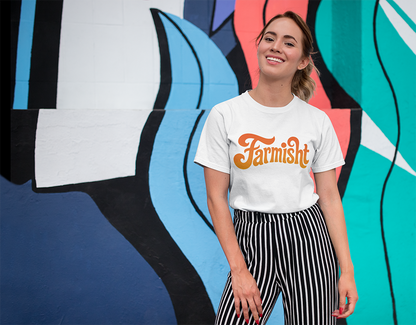 Person wearing a white t-shirt with 'Farmish' logo in front of a colorful mural.