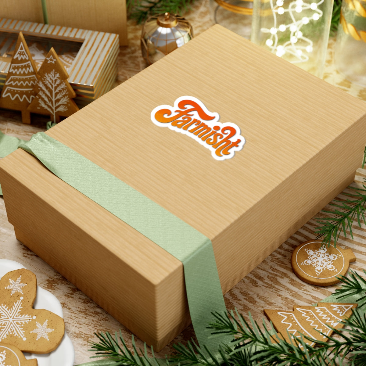 Wooden gift box with a green ribbon and 'Fermi' logo on a festive background with cookies and lights.