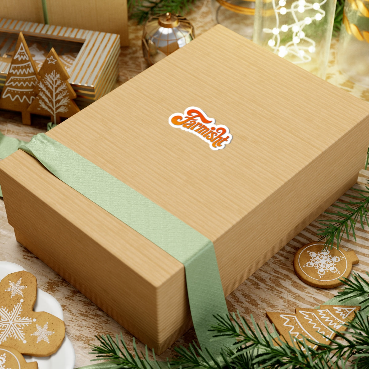 Wooden gift box with a green ribbon on a festive background with cookies and lights