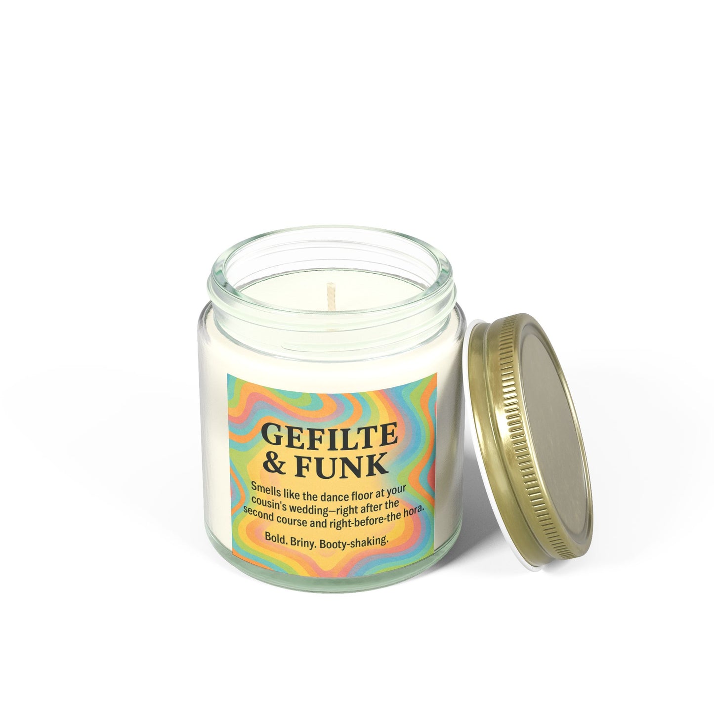 Candle in a glass jar with a colorful label on a white background