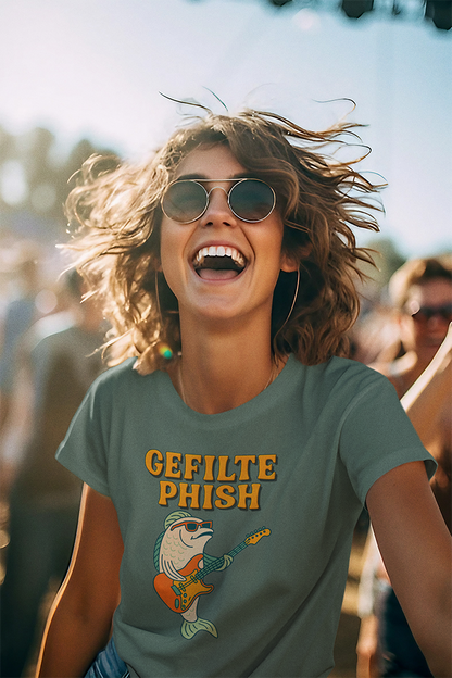Person wearing a 'Gefilte Phish' t-shirt at a music festival