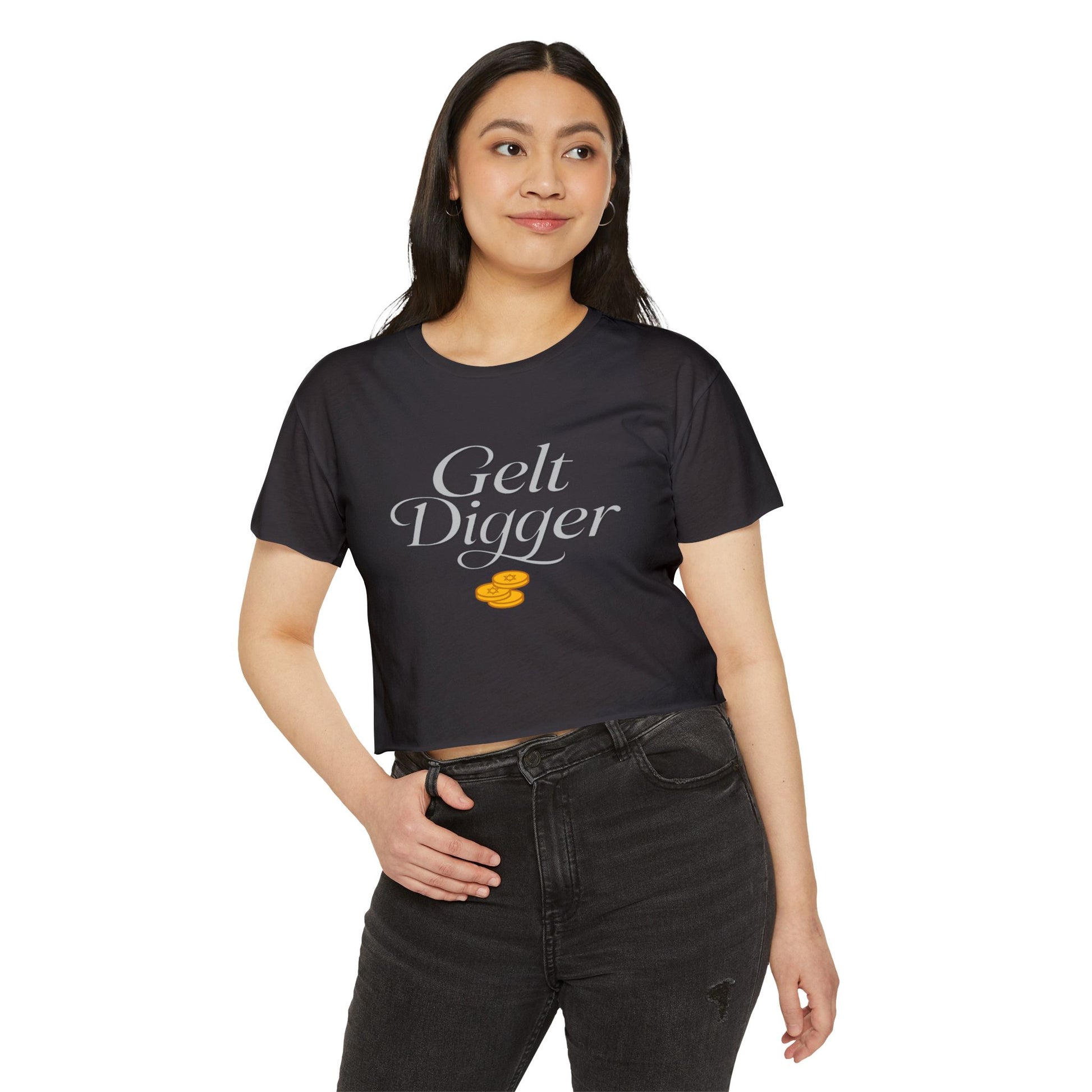Woman wearing a black t-shirt with 'Gelt Digger' text and a dollar sign graphic on a white background