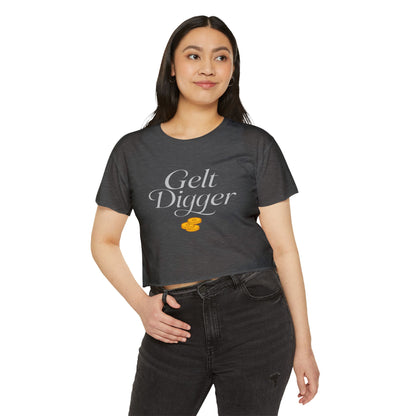 Woman wearing a dark gray t-shirt with 'Gelt Digger' text and an orange dollar sign on a white background