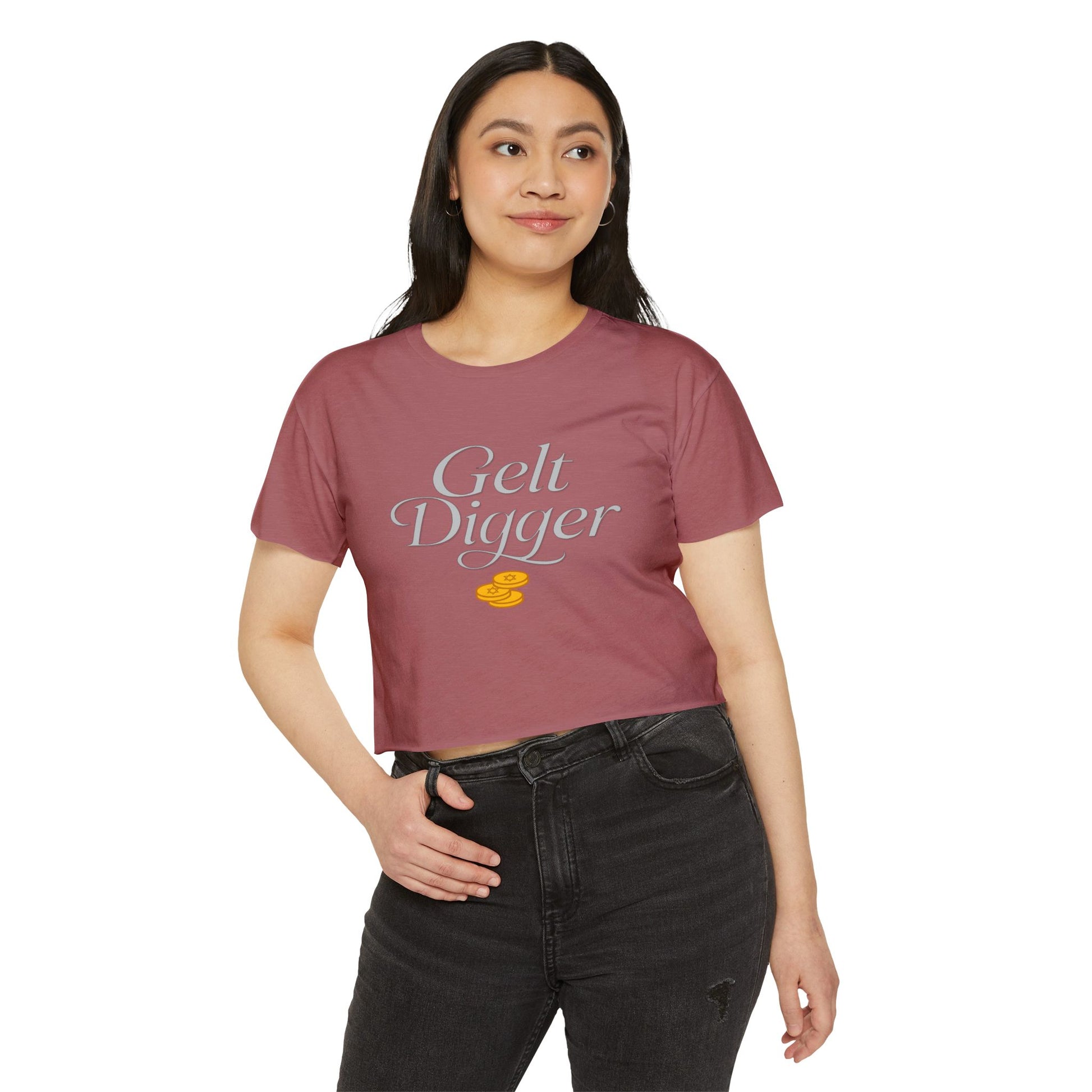 Woman wearing a maroon t-shirt with 'Gelt Digger' text on a white background