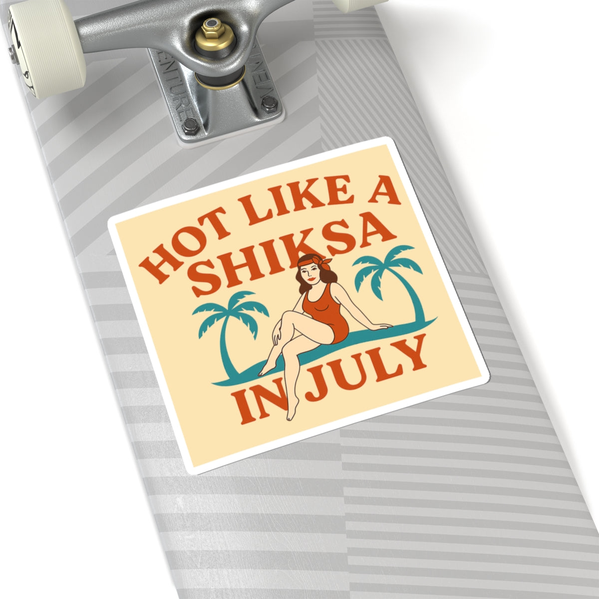 Sticker with text 'Hot Like a Shiksa in July' on a skateboard deck.