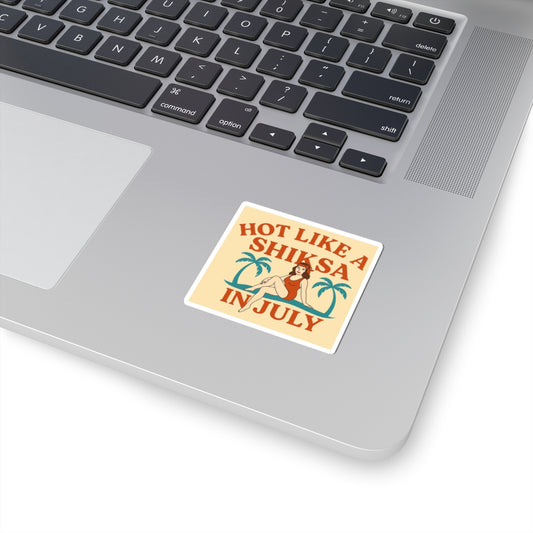 Laptop with a sticker reading 'Hot like a shiksa in July' on the palm rest area.