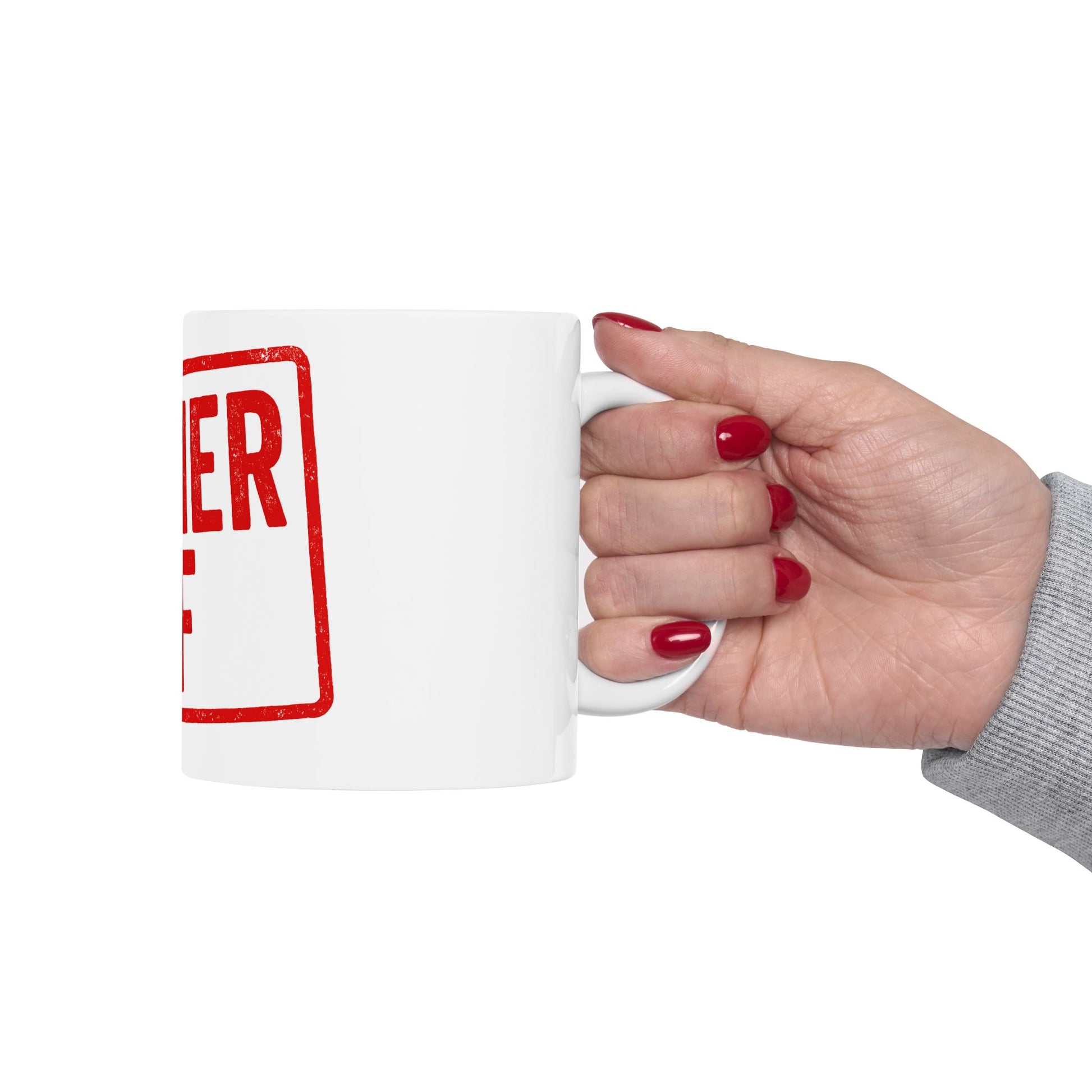 Hand holding a white mug with 'kosher af' in red text on a white background