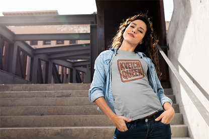 Woman wearing a 'Kvetch Queen' t-shirt standing on outdoor steps.