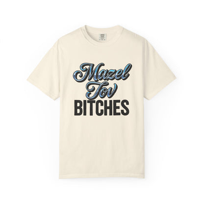Beige t-shirt with 'Mazel Tov Bitches' text on a white background