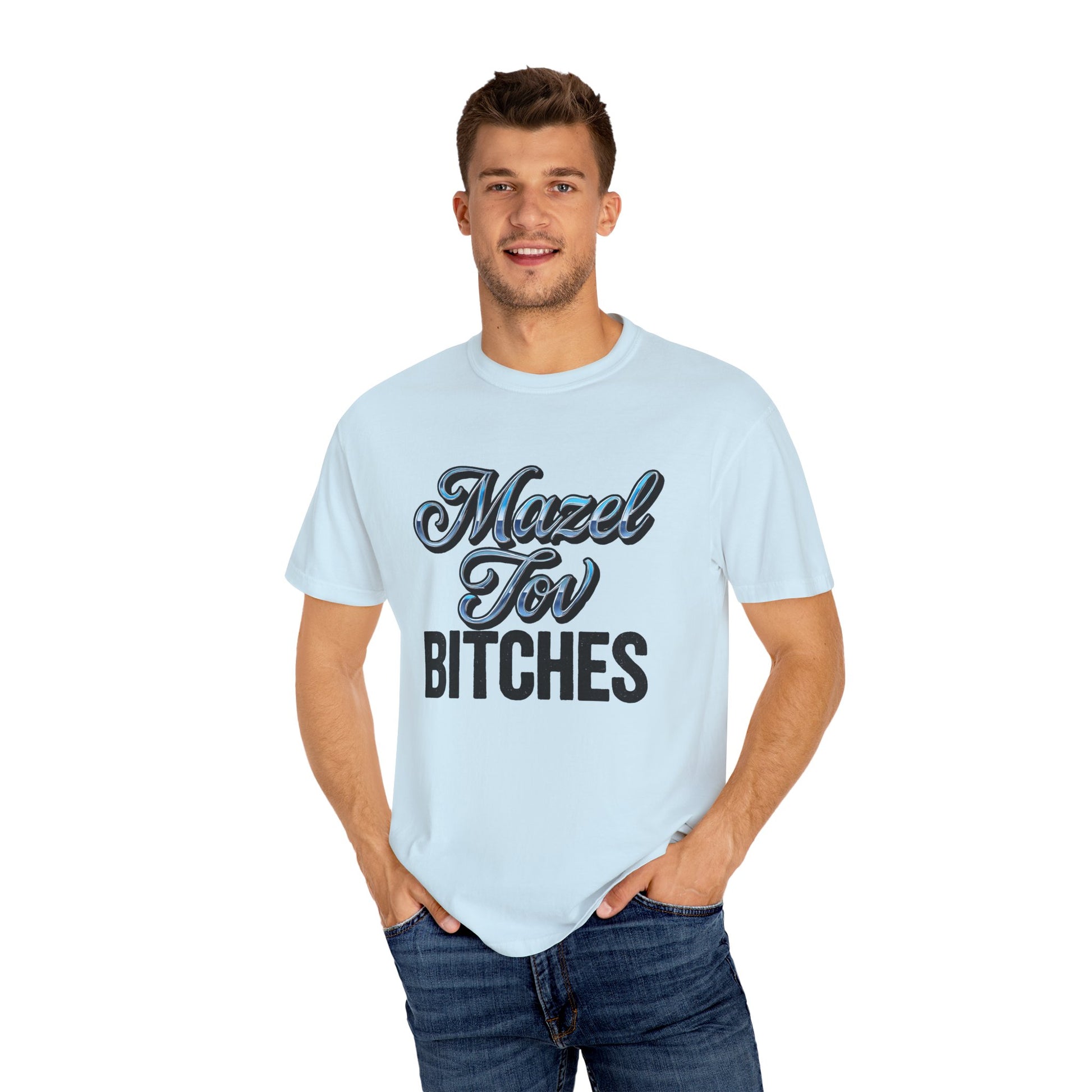 Man wearing a light blue t-shirt with text, standing against a white background