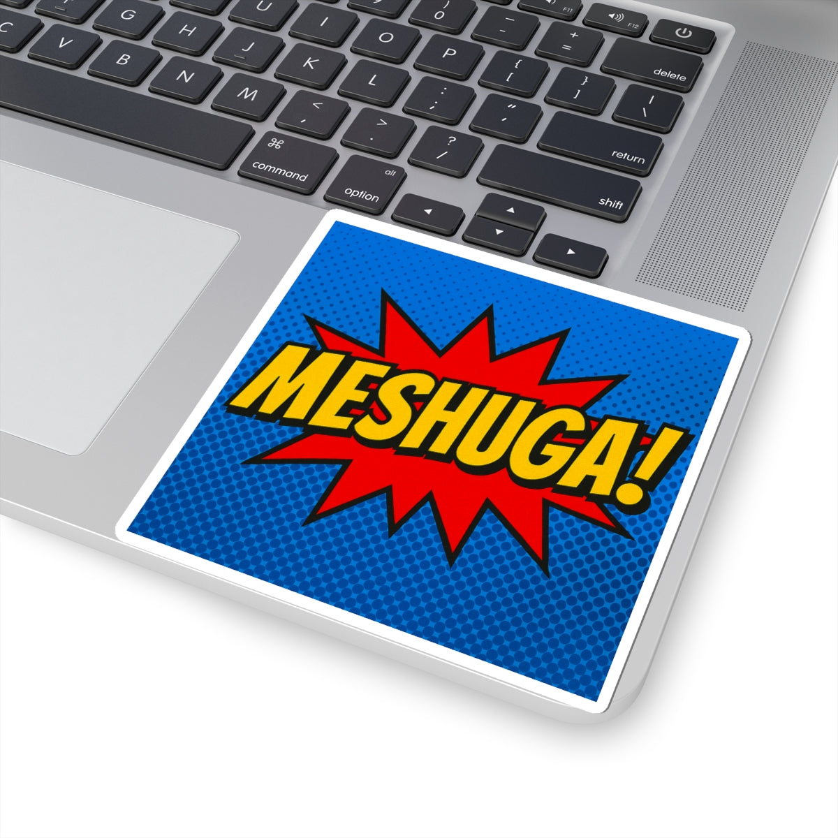 Laptop with a 'Meshuga!' sticker on the palm rest area