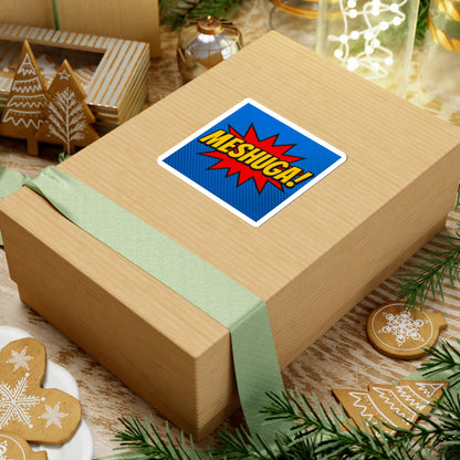 Wooden gift box with a 'MESHUGA!' sticker on a festive background with cookies and greenery.