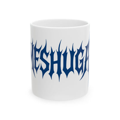 White mug with blue 'meshuga' text on a white background