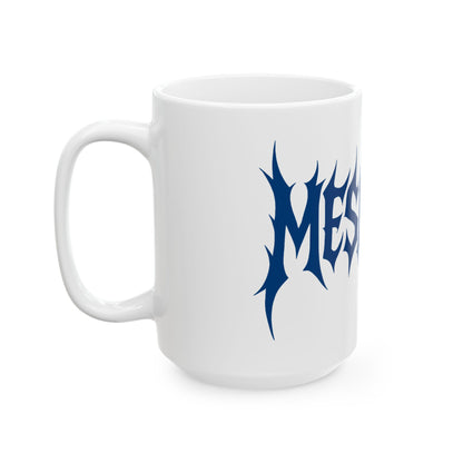 White mug with blue 'meshuga' design on a white background
