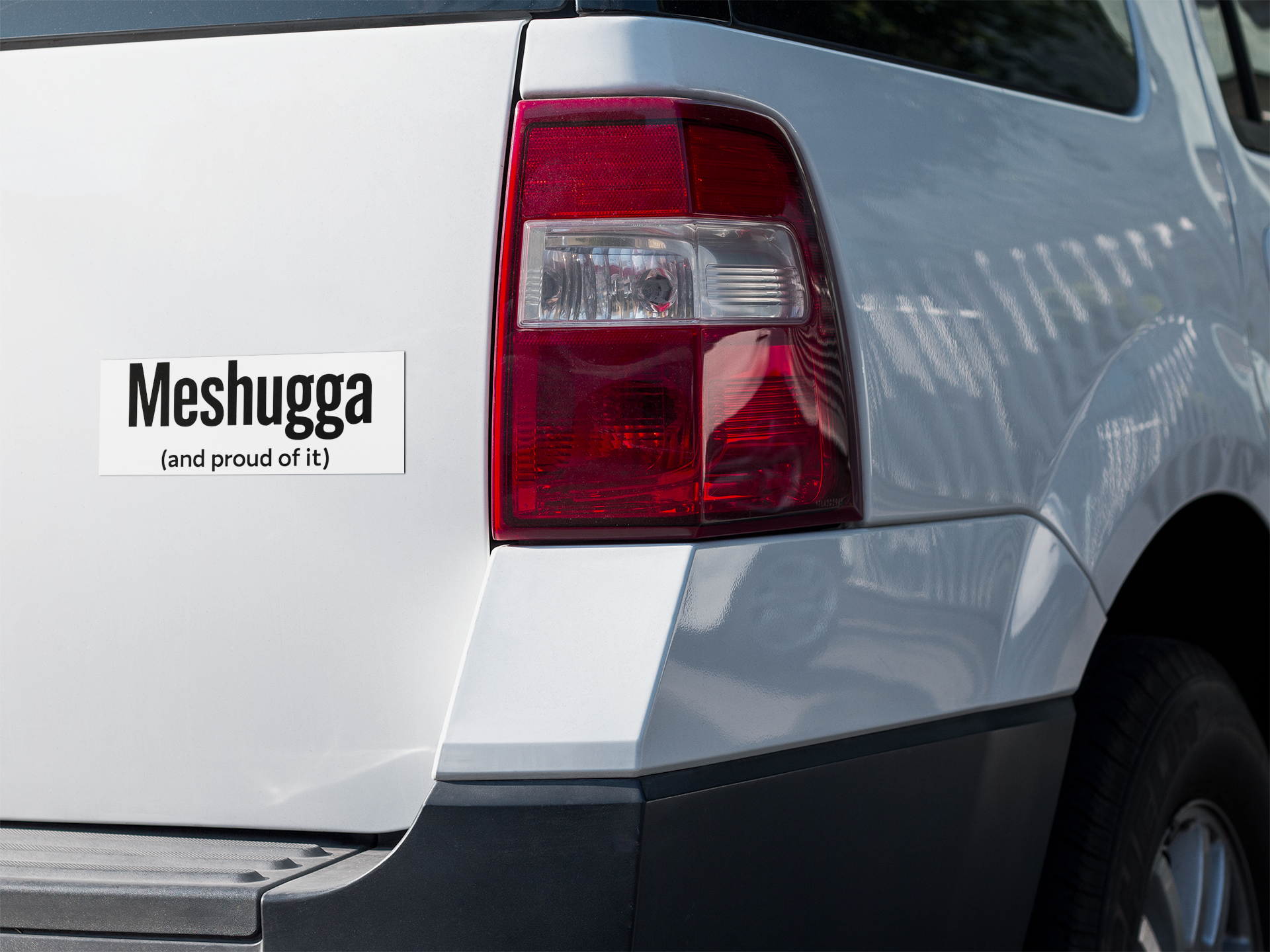 Car with 'Meshugga (and proud of it)' decal on the back