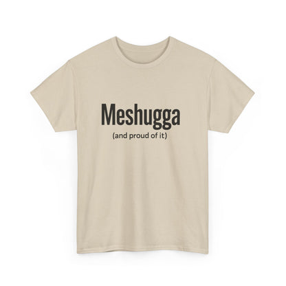 Beige t-shirt with black text 'Meshugga (and proud of it)' on a white background
